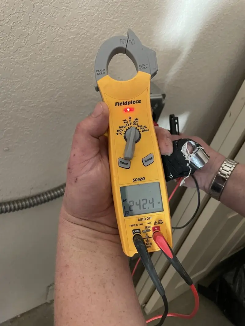 Voltage testing with clamp meter during Electrical Installation Services in Gates